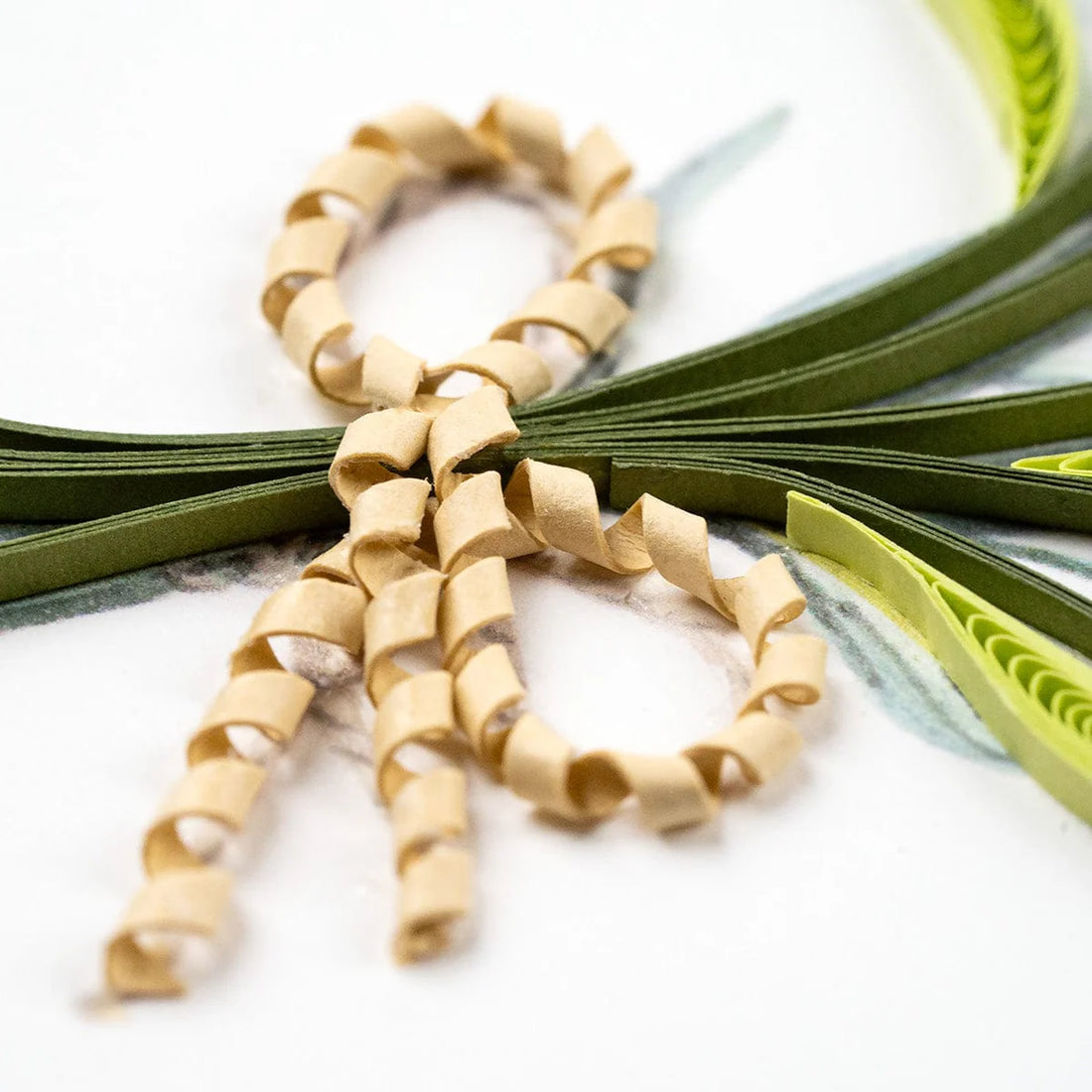 Scissors with beige ribbon loops on a white background - okotoks hc pharmacy