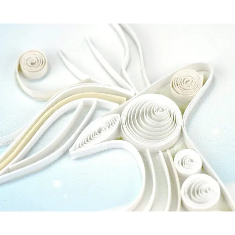 White paper quilling design on a light blue background - okotoks hc pharmacy
