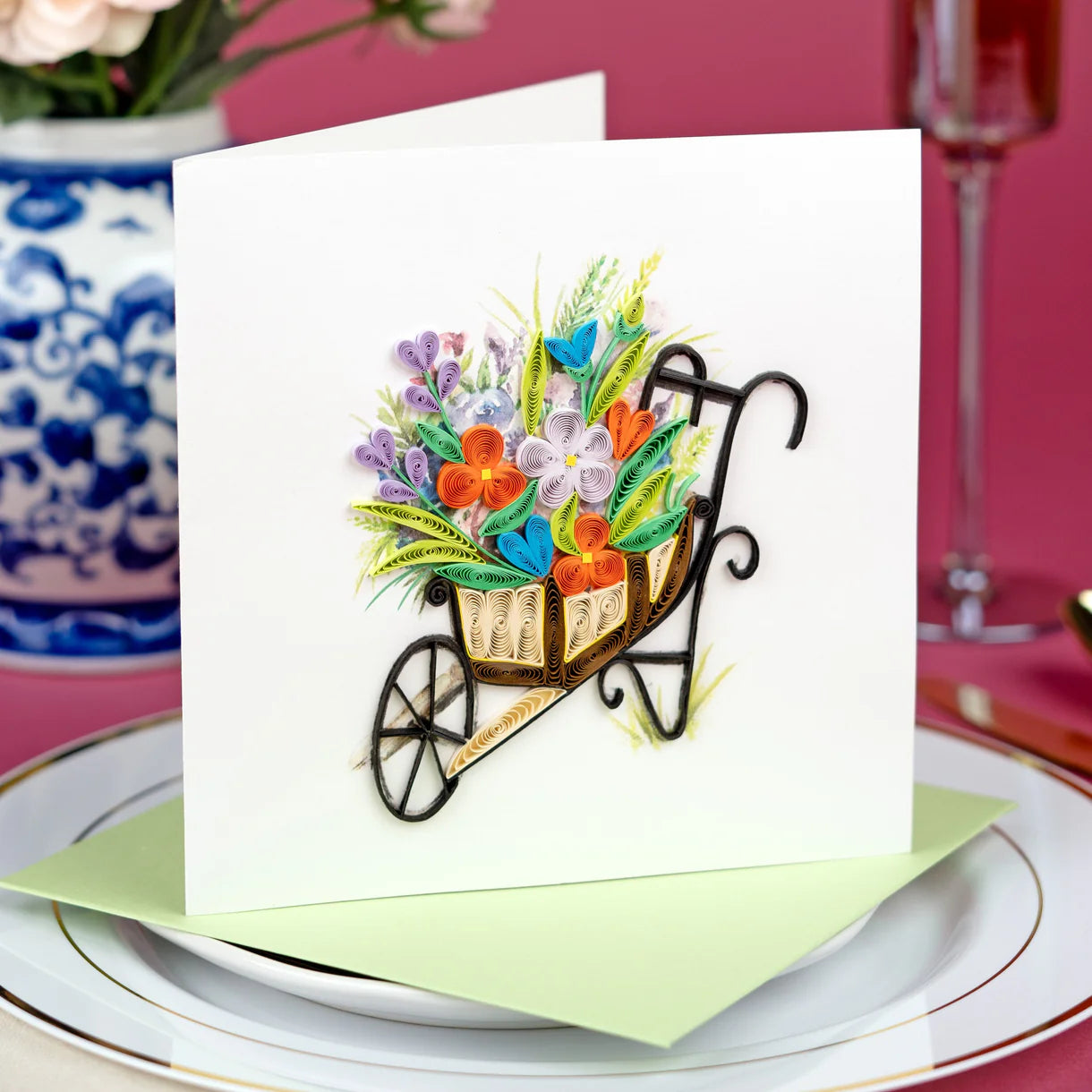 Greeting card with floral wheelbarrow design on a table setting - okotoks hc pharmacy