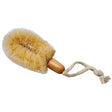 A natural tan scrub brush with dense soft bristles, a smooth wooden handle, and an attached knotted rope loop, shown on a plain white background. - okotoks hc pharmacy