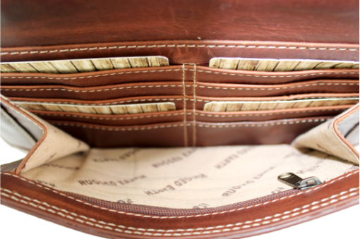 Brown leather wallet with visible stitching and brand name on a white background - okotoks hc pharmacy