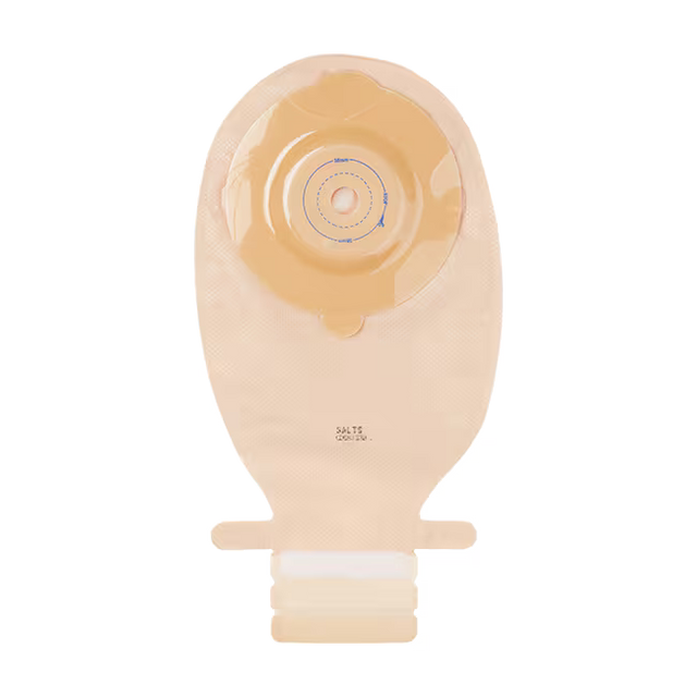 A beige plastic ostomy bag with a matching beige adhesive flap and a white connector collar at the bottom, shown against a plain white background. - okotoks hc pharmacy