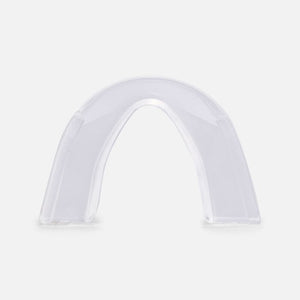 A clear, semi-transparent arch-shaped mouthguard or dental tray shown on a plain light gray background. - okotoks hc pharmacy
