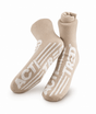 A pair of beige crew socks with bold white 'ACT! TREAD' text and stripe graphics on the soles, displayed against a clean white background. - okotoks hc pharmacy