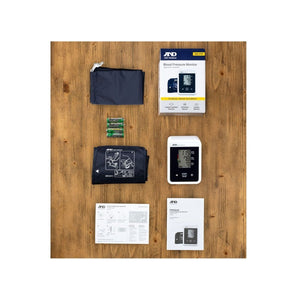 Blood pressure monitor set with accessories on a wooden surface - Okotoks HC Pharmacy