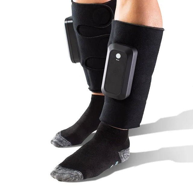 Black leg compression device on a person's legs with a white background - okotoks hc pharmacy