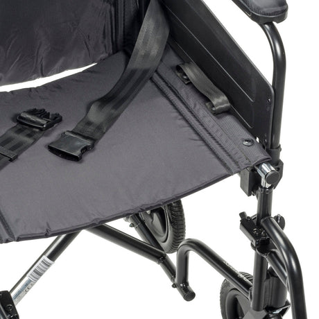 Close-up of a black wheelchair with a folded seat cover on a white background - okotoks hc pharmacy