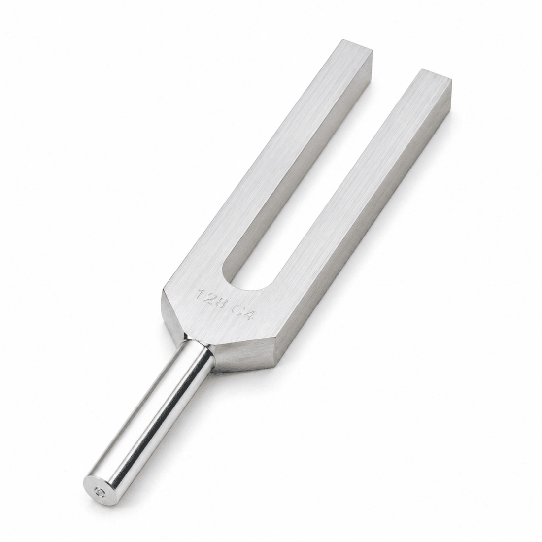 A stainless steel tuning fork with a brushed metal finish and a polished stem, shown on a clean white background. - okotoks hc pharmacy