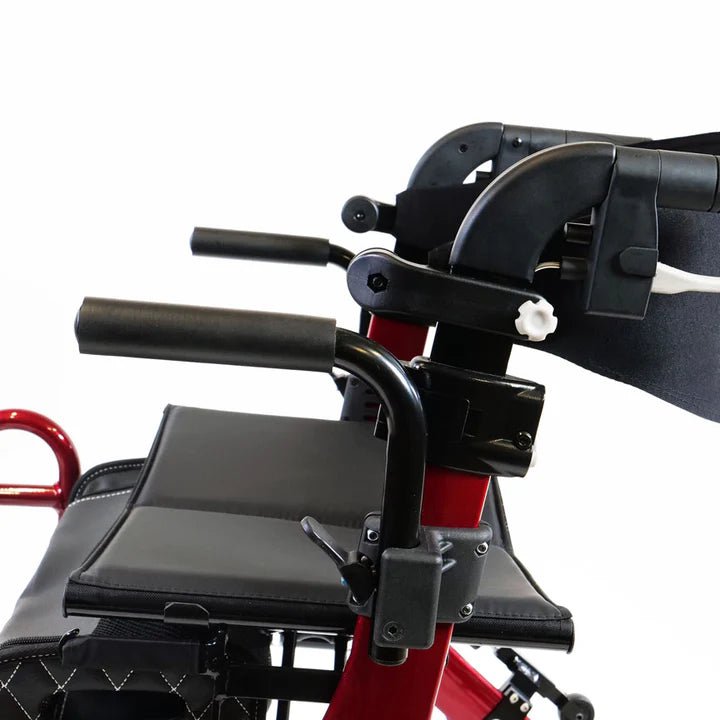 Close-up of a red and black mobility scooter with a focus on the seat and handlebar area. - okotoks hc pharmacy