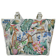 Tote bag with a tropical design featuring leopards, flowers, and leaves on a white background. - okotoks hc pharmacy