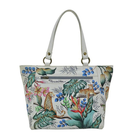 Handbag with a tropical design featuring leopards and foliage on a white background. - okotoks hc pharmacy