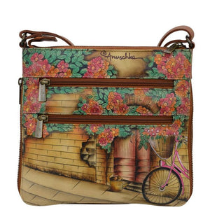 Floral-patterned crossbody bag with a bicycle design on a white background - okotoks hc pharmacy