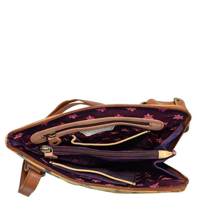 Open brown leather handbag with floral interior lining on a white background - okotoks hc pharmacy