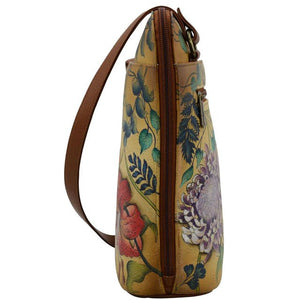 Floral-patterned handbag with a brown strap on a white background - okotoks hc pharmacy