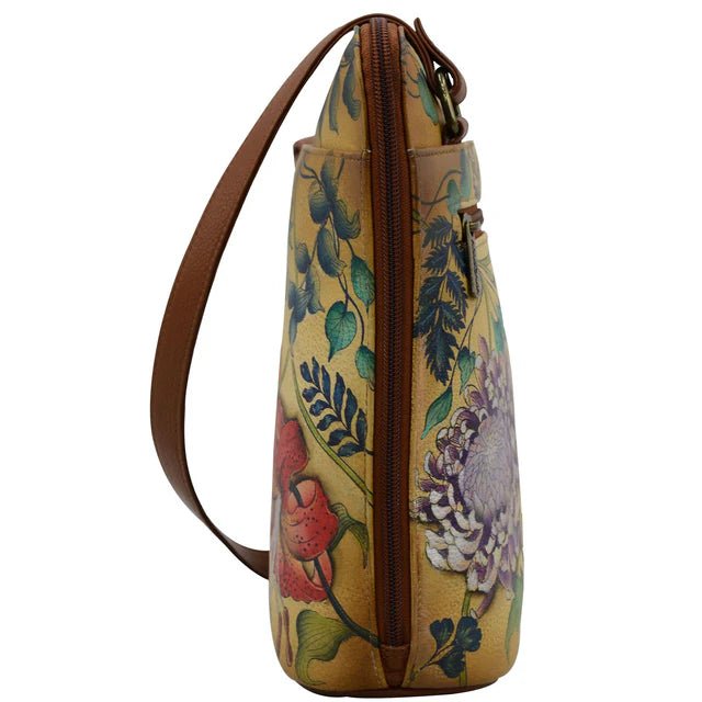 Floral-patterned handbag with a brown strap on a white background - okotoks hc pharmacy