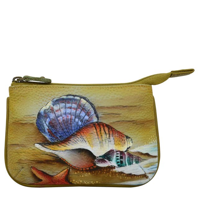 Hand-painted shell design on a small pouch with a white background - okotoks hc pharmacy