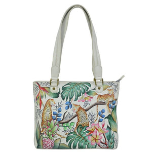 Handbag with tropical animal and plant design on a white background - okotoks hc pharmacy