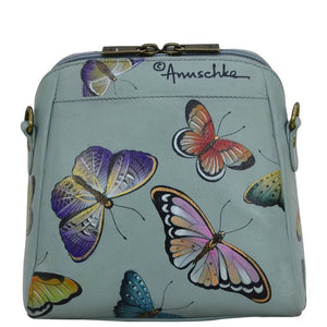 Light blue crossbody bag with colorful butterfly designs on a white background - okotoks hc pharmacy