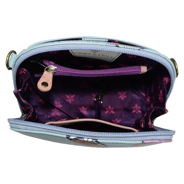 Open handbag showing purple interior with floral pattern on a white background - okotoks hc pharmacy