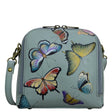 Light blue handbag with colorful butterfly designs on a white background - okotoks hc pharmacy
