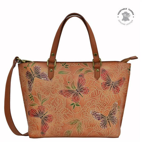 Brown leather handbag with butterfly pattern on a white background - okotoks hc pharmacy