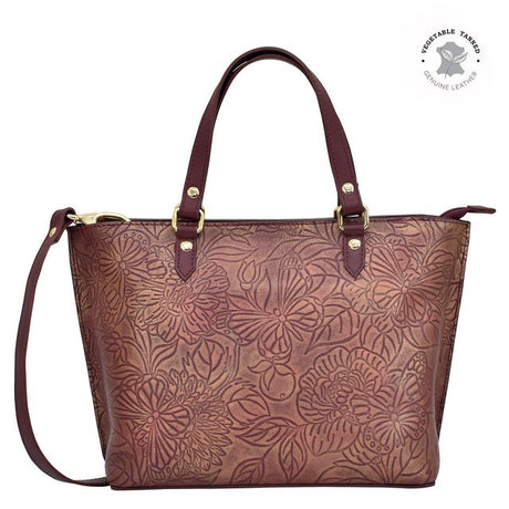 Brown floral embossed handbag with gold accents on a white background - okotoks hc pharmacy