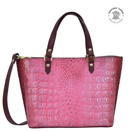 Pink textured handbag with brown handles and strap on a white background - okotoks hc pharmacy