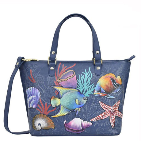 Blue handbag with ocean-themed design featuring fish, corals, and shells on a white background. - okotoks hc pharmacy