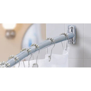 Curtain rod with decorative rings on a tiled bathroom wall - okotoks hc pharmacy