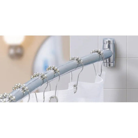 Curtain rod with decorative rings on a tiled bathroom wall - okotoks hc pharmacy