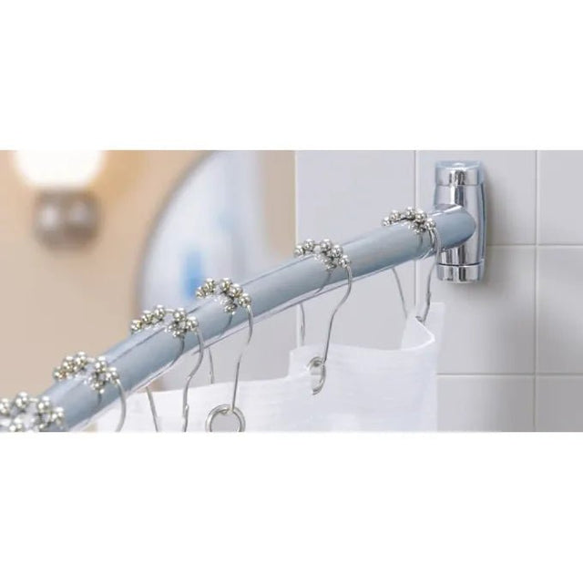Curtain rod with decorative rings on a tiled bathroom wall - okotoks hc pharmacy