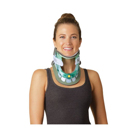 Woman wearing a green neck brace against a white background - okotoks hc pharmacy