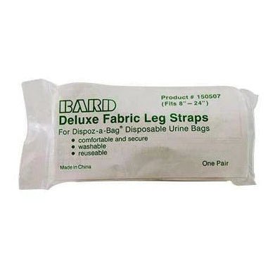 A packaged pair of Bard Deluxe Fabric Leg Straps, shown in its white plastic wrapper with green text on a plain white background. - okotoks hc pharmacy