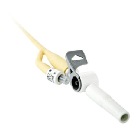 A medical catheter connector with a beige/cream plastic sheath, a white plastic connector tip, and a silver metal clamp with a black center, shown on a plain white background. - okotoks hc pharmacy