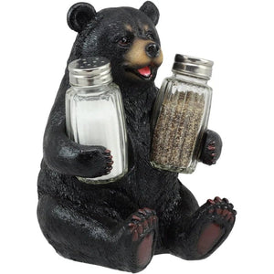 Bear figurine holding salt and pepper shakers on a white background - okotoks hc pharmacy