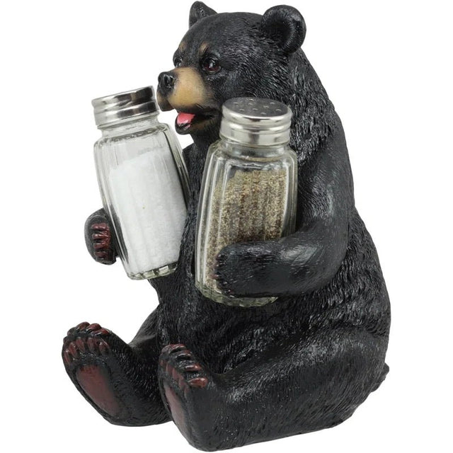 Bear figurine holding salt and pepper shakers on a white background - okotoks hc pharmacy