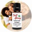 A 15 ml bottle of Bell Spring 'Fruity Craze Energize!' essential oil centered over a circular background photo of a smiling couple, with the product label clearly visible. - okotoks hc pharmacy