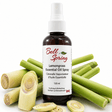 Bell Spring Lemongrass Essential Oil Spray bottle in amber glass with a white spray cap, surrounded by fresh green lemongrass stalks and sliced pieces on a white background. - okotoks hc pharmacy