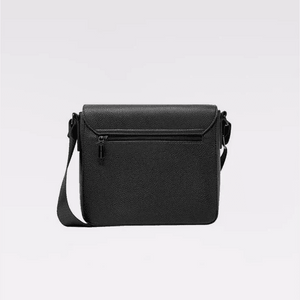 A black pebbled leather crossbody bag with a front zippered pocket and a matching shoulder strap, shown against a plain light gray background. - okotoks hc pharmacy