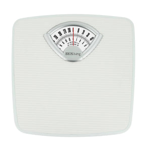 White mechanical bathroom scale with a dial on a white background - okotoks hc pharmacy