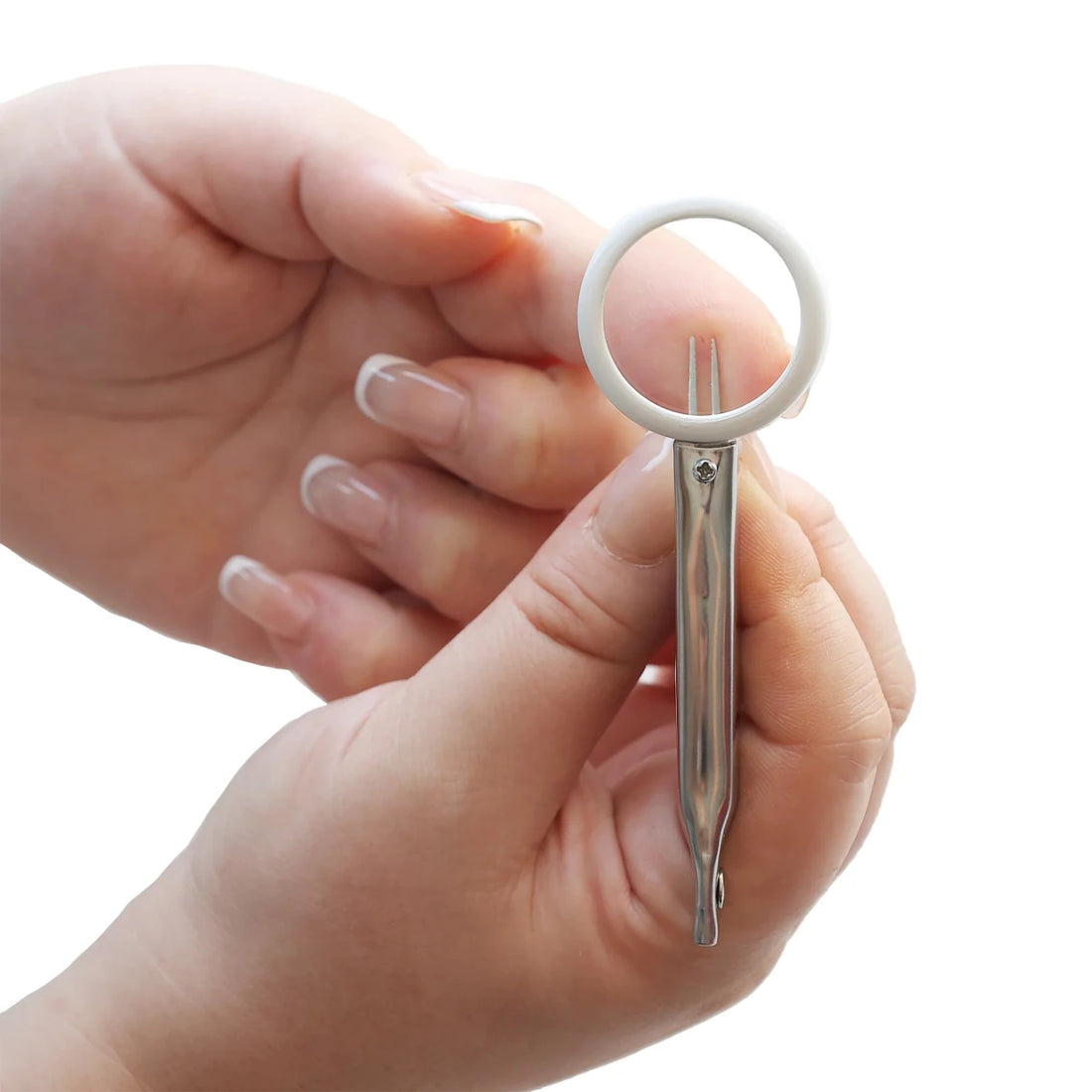 Small tweezers held between fingers on a white background - okotoks hc pharmacy