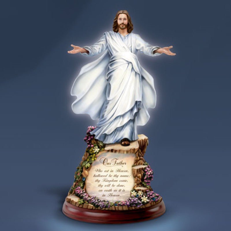 Statue of Jesus figure with outstretched arms on a dark blue background - okotoks hc pharmacy
