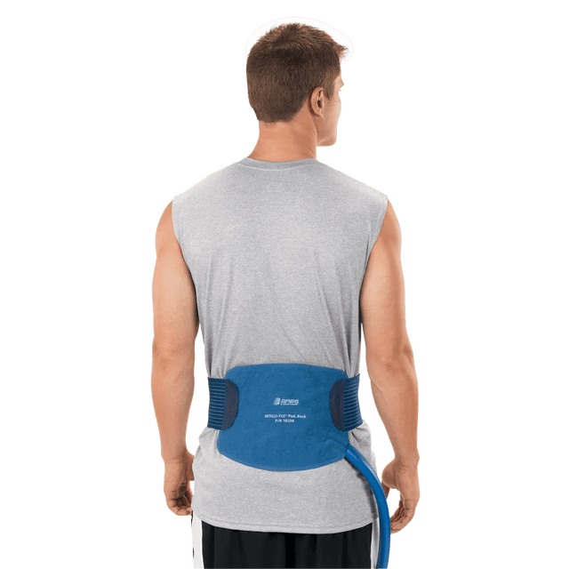 Man wearing a blue back brace on a white background - okotoks hc pharmacy