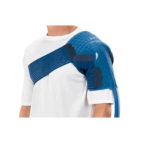 Blue shoulder brace on a person wearing a white shirt against a white background - okotoks hc pharmacy