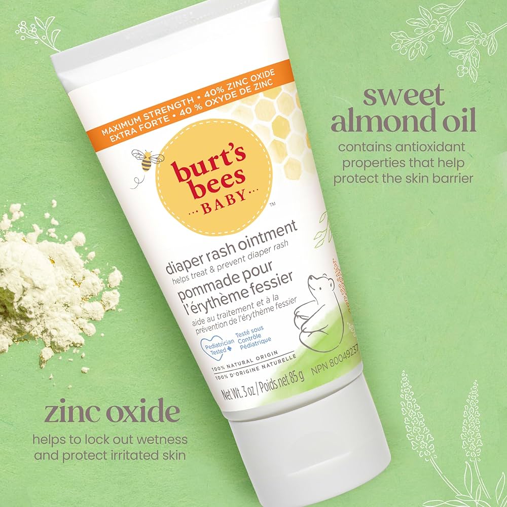 Burt's Bees Baby diaper rash ointment tube on a green background with floral elements. - okotoks hc pharmacy