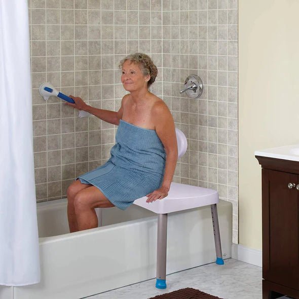 Woman using a bath safety rail in a bathroom setting - okotoks hc pharmacy