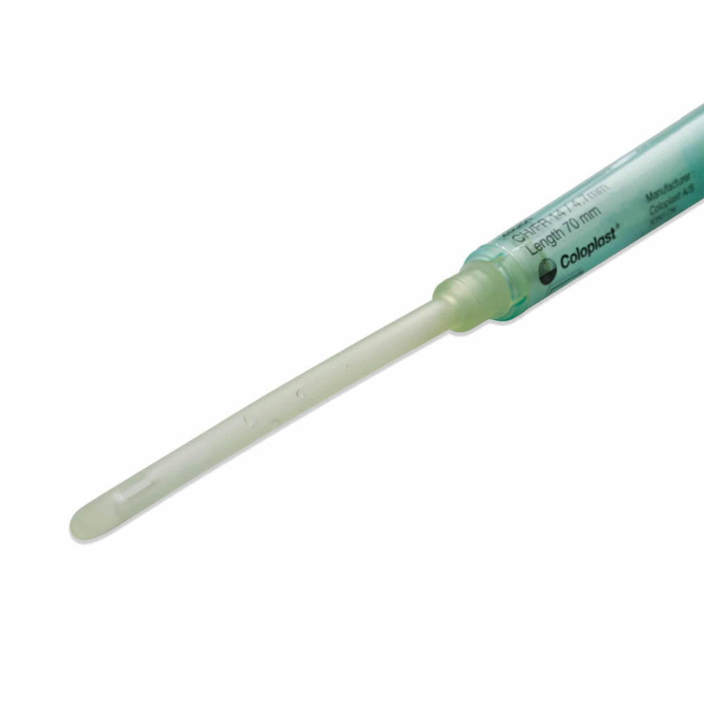 A single Coloplast flexible colostomy tube, shown diagonally on a plain white background. The tube is made of translucent light green plastic with a pale yellow-green silicone tip. - okotoks hc pharmacy