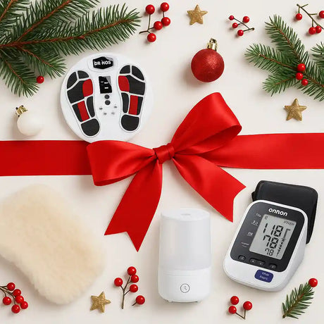 Health monitoring devices with a red ribbon on a festive background with Christmas decorations.