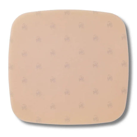 Beige square cushion with subtle pattern on a white background - okotoks hc pharmacy