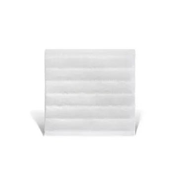 White dressing with a textured surface on a white background - okotoks hc pharmacy